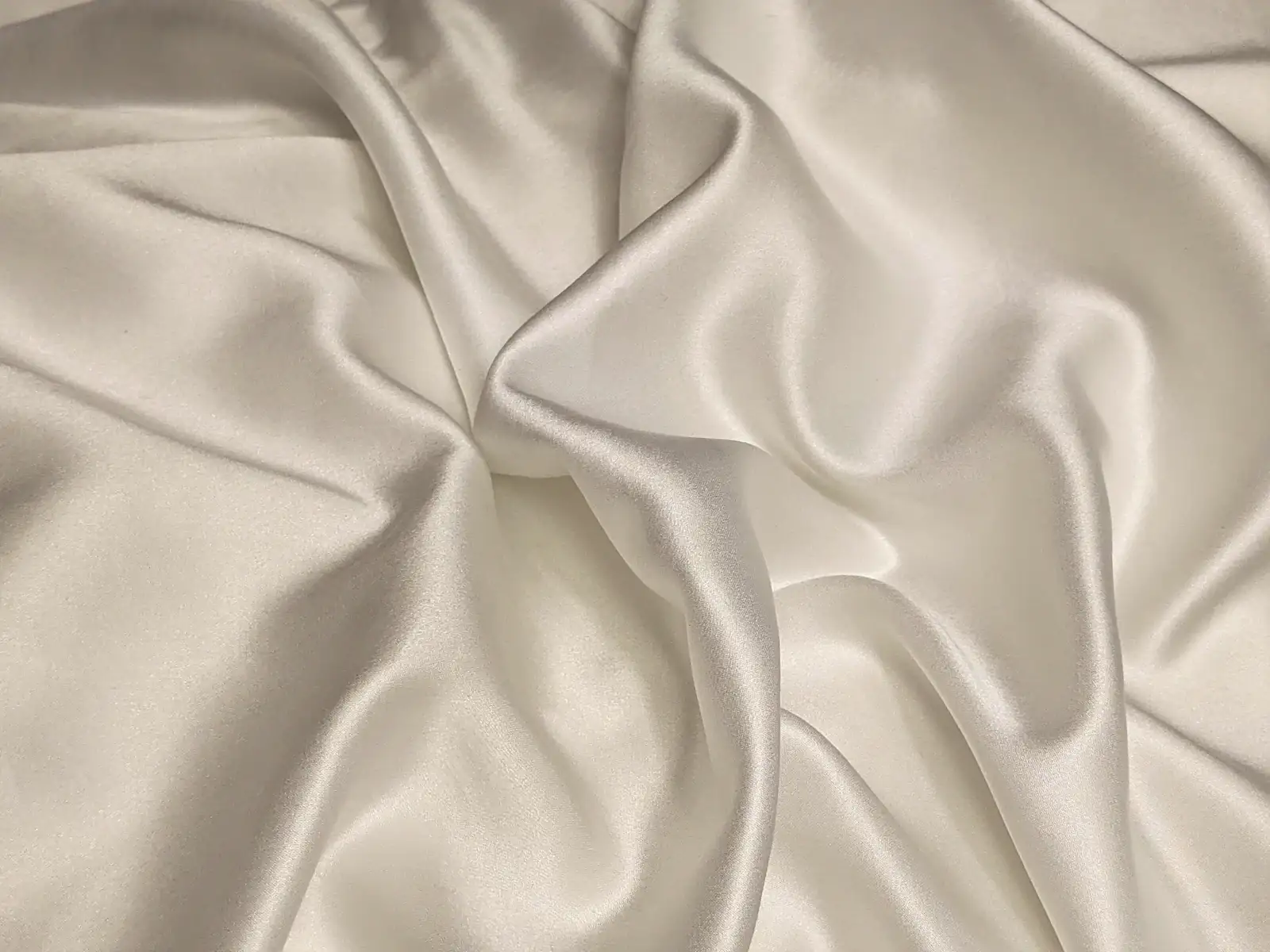 Soft folds of cream silk