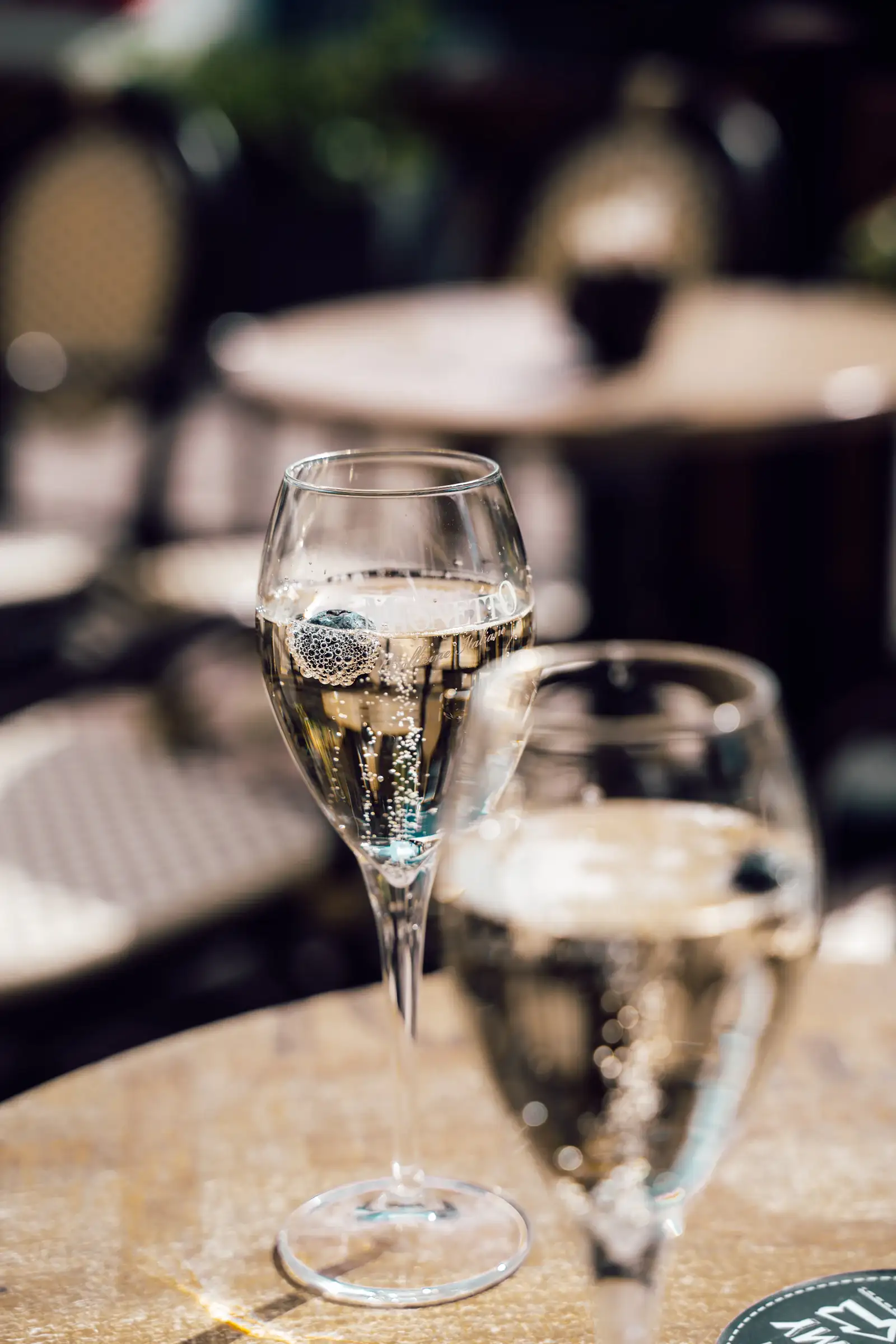 Two glasses of champagne on a table